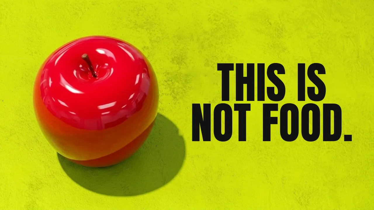 Thumbnail reading THIS IS NOT FOOD. beside a glossy red apple on acid green
